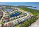Wide aerial view of homes and a lake community with lush landscaping and beautiful waterfront homes at 6228 Champions Row St, Bradenton, FL 34210