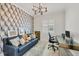Cozy office with modern geometric wallpaper and comfortable seating at 6228 Champions Row St, Bradenton, FL 34210