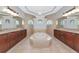 Beautiful bathroom features a large tub, dual vanities, and decorative tile at 6407 213Th E St, Bradenton, FL 34211