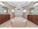 Beautiful bathroom features a large soaking tub and dual vanities at 6407 213Th E St, Bradenton, FL 34211