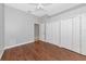 Bright bedroom features hardwood floors, closet storage, and neutral paint at 6407 213Th E St, Bradenton, FL 34211