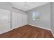 Light-filled bedroom features hardwood floors, closet storage, and neutral paint at 6407 213Th E St, Bradenton, FL 34211
