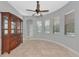 Dining room with tile flooring, ceiling fan, wood china cabinet and natural light at 6407 213Th E St, Bradenton, FL 34211