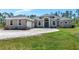 Beautiful single story home featuring a spacious lawn, large driveway, and an attached two car garage at 6407 213Th E St, Bradenton, FL 34211