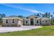 Beautiful home with a spacious driveway and well-manicured lawn at 6407 213Th E St, Bradenton, FL 34211