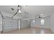 Spacious garage with two garage doors and ceiling fan at 6407 213Th E St, Bradenton, FL 34211