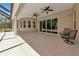 Expansive covered lanai with ceiling fans, offering a comfortable outdoor living space at 6407 213Th E St, Bradenton, FL 34211