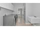 Convenient laundry room with sink and modern washer and dryer set at 6407 213Th E St, Bradenton, FL 34211