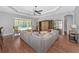 Spacious and stylish living room with wood floors, comfortable seating, and sliding glass doors to backyard at 6407 213Th E St, Bradenton, FL 34211