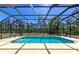 Inviting screened-in pool with an expansive backyard view at 6407 213Th E St, Bradenton, FL 34211