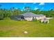 The back of the home showcases a screened pool area and a spacious backyard at 6407 213Th E St, Bradenton, FL 34211