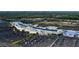 Aerial shot features a sprawling shopping mall surrounded by ample parking and verdant green spaces at 7173 W Country Club N Dr # 141, Sarasota, FL 34243