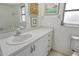 Clean bathroom featuring a white vanity with ample storage and modern fixtures at 7173 W Country Club N Dr # 141, Sarasota, FL 34243