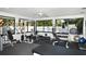 Well-equipped fitness center with exercise machines, weights, and a view of the pool at 7173 W Country Club N Dr # 141, Sarasota, FL 34243