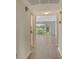 Inviting hallway leading into a light-filled living space with scenic views at 7173 W Country Club N Dr # 141, Sarasota, FL 34243