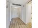 Bright hallway featuring modern flooring, fresh paint, and a welcoming entrance at 7173 W Country Club N Dr # 141, Sarasota, FL 34243