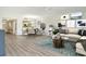 Open-concept living area and dining room with stylish decor and lots of natural light at 7173 W Country Club N Dr # 141, Sarasota, FL 34243