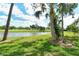 View of the community pond and landscaped grounds at 7173 W Country Club N Dr # 141, Sarasota, FL 34243