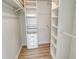 Spacious walk-in closet with custom shelving and drawers for optimal storage at 7173 W Country Club N Dr # 141, Sarasota, FL 34243