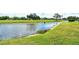 Scenic water view along community lawn at 7173 W Country Club N Dr # 141, Sarasota, FL 34243