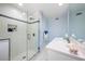 Updated bathroom has tile flooring, glass-enclosed shower, and a modern vanity at 8592 Hidden Lagoon Rd, Sarasota, FL 34242