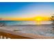 Beachfront view with a stunning sunset over the Gulf at 8592 Hidden Lagoon Rd, Sarasota, FL 34242