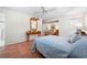 Comfortable bedroom boasts a ceiling fan and adjoins a bathroom at 8592 Hidden Lagoon Rd, Sarasota, FL 34242