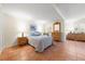 Relaxing bedroom featuring tile flooring, coastal decor, and comfortable furnishings at 8592 Hidden Lagoon Rd, Sarasota, FL 34242