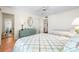 Cozy bedroom with two beds, tile flooring, ceiling fan, and wicker dresser at 8592 Hidden Lagoon Rd, Sarasota, FL 34242