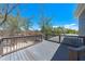 Gray deck with views of a wooded area at 8592 Hidden Lagoon Rd, Sarasota, FL 34242