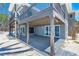 Stunning two-story home with a spacious deck and outdoor shower near the beach access at 8592 Hidden Lagoon Rd, Sarasota, FL 34242