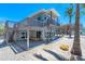 Two-story home with decks and stairs, conveniently located right off the beach with blue skies at 8592 Hidden Lagoon Rd, Sarasota, FL 34242