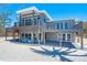 Two-story beach home with decks and outdoor seating to enjoy the ocean breeze and views at 8592 Hidden Lagoon Rd, Sarasota, FL 34242