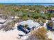 Coastal home boasts a spacious deck, perfect for enjoying waterfront views and outdoor relaxation at 8592 Hidden Lagoon Rd, Sarasota, FL 34242