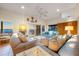 Bright and airy living room featuring ocean views and plush sofas at 8592 Hidden Lagoon Rd, Sarasota, FL 34242