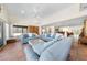 Inviting living area with comfortable sofas, tile flooring, and ample natural light at 8592 Hidden Lagoon Rd, Sarasota, FL 34242