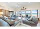 Open living area with comfortable seating, ocean views, and lots of natural light at 8592 Hidden Lagoon Rd, Sarasota, FL 34242