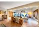 Bright living room with terracotta tile, comfortable seating, and expansive windows offering stunning ocean views at 8592 Hidden Lagoon Rd, Sarasota, FL 34242