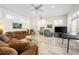 Bright living room showcasing whitewashed floors, recessed lighting, and multiple seating areas at 8592 Hidden Lagoon Rd, Sarasota, FL 34242