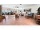 Spacious living room showcasing comfortable seating, artful decor, and views of the ocean at 8592 Hidden Lagoon Rd, Sarasota, FL 34242