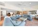 Comfortable living area with tiled floors, ocean views, and plenty of seating at 8592 Hidden Lagoon Rd, Sarasota, FL 34242