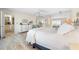 Large main bedroom features whitewashed floors, mirrored closets, and an ensuite bathroom at 8592 Hidden Lagoon Rd, Sarasota, FL 34242