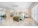 Relaxing main bedroom features whitewashed floors, a mirrored closet, and access to ensuite bathroom at 8592 Hidden Lagoon Rd, Sarasota, FL 34242