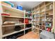 Spacious storage room features ample shelving and tile flooring at 8592 Hidden Lagoon Rd, Sarasota, FL 34242