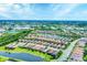 Expansive aerial view showcasing a residential community with scenic ponds and green spaces at 8721 Trattoria Ter, Sarasota, FL 34238