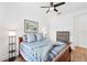 Inviting bedroom features hardwood floors, ceiling fan, and a calming aesthetic at 8721 Trattoria Ter, Sarasota, FL 34238