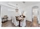 Bright dining room with modern light fixtures and a stylish aesthetic at 8721 Trattoria Ter, Sarasota, FL 34238