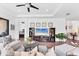 Bright, open-plan living room with modern decor, seamlessly flowing to dining area at 8721 Trattoria Ter, Sarasota, FL 34238
