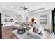 Open-concept living room features lots of natural light and hardwood floors at 8721 Trattoria Ter, Sarasota, FL 34238
