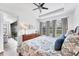 Primary bedroom with hardwood floors, large windows and view to outdoor patio at 8721 Trattoria Ter, Sarasota, FL 34238